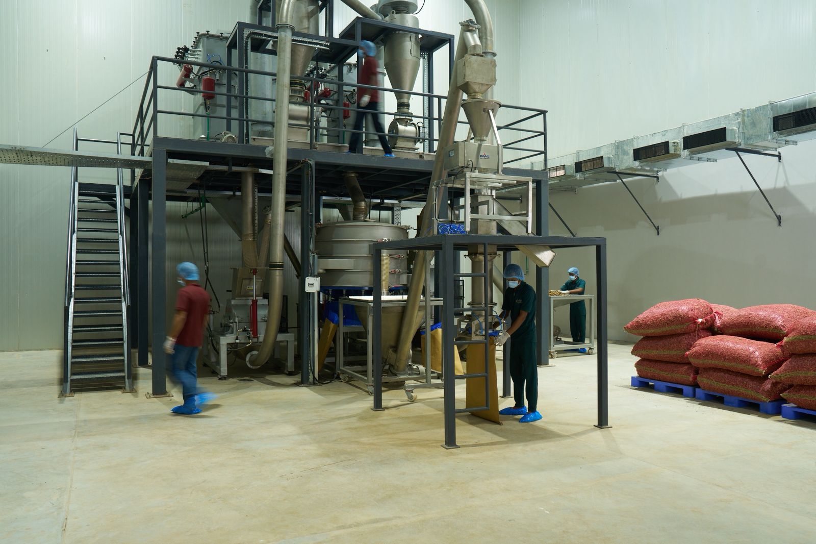 Dry ingredient handling and blending in a commercial manufacturing environment.